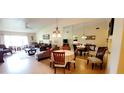 Open-concept living and dining area with lots of natural light, with an elegant dining set and comfortable furniture at 3505 Tarpon Woods Blvd # P408, Palm Harbor, FL 34685