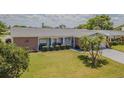 Inviting single-story home with a beautifully landscaped front yard at 4014 Pleasant Ridge Dr, New Port Richey, FL 34652