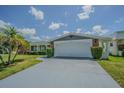 Charming home with a freshly painted two-car garage and a well-maintained lawn at 4014 Pleasant Ridge Dr, New Port Richey, FL 34652