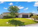 Inviting single-story home with a well-maintained lawn and manicured landscaping under a bright sky at 4425 13Th Ne Way, St Petersburg, FL 33703