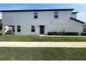 Exterior view of townhome, showing yard and entryway at 5310 Companion Ln, Tampa, FL 33619