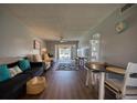 Inviting living room featuring wood floors and neutral walls, creating a comfortable and welcoming atmosphere at 712 Cordova Greens # 712, Largo, FL 33777