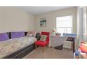 Cozy bedroom featuring soft lighting, a daybed, and serene decor at 1022 Chandler Snowden Ct, Ruskin, FL 33570