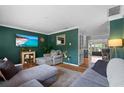 Inviting living room with stylish decor, hardwood floors, and an open layout at 1526 San Mateo Dr, Dunedin, FL 34698