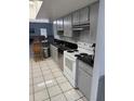Features stainless steel appliances, tile floors, and a breakfast bar at 2026 Aaron Pl, Clearwater, FL 33760