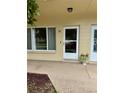 Unit entrance featuring a white door and window at 2360 Irish Ln # 16, Clearwater, FL 33763