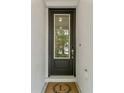 The front door is black with a window and decorative wreath at 412 S Albany Ave # 2, Tampa, FL 33606