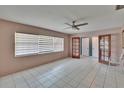 Bright, airy living room featuring tile flooring, a ceiling fan, and natural light from the window at 508 E Brentridge, Brandon, FL 33511