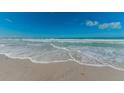 Calm ocean view with gentle waves and a clear blue sky on a sandy beach at 650 70Th Ave, St Pete Beach, FL 33706