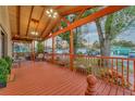 Spacious front porch with craftsman style wood beams and railings at 7010 N Hubert Ave, Tampa, FL 33614