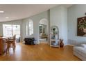 Inviting room with hardwood floors, views of the backyard, and access to the Gathering room at 7838 Trail Run Loop, New Port Richey, FL 34653