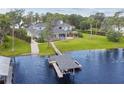 Expansive home featuring lake access with a private dock and beautiful outdoor space at 919 Ballinger Rd, Lutz, FL 33548