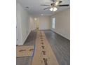 Bright, airy living room featuring luxury vinyl plank flooring, neutral paint, and abundant natural light at 1107 Howard St, Clearwater, FL 33756