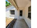 Inviting home entryway featuring tile flooring and a textured stucco exterior at 1262 Jeffords St, Clearwater, FL 33756
