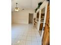 Bright living room featuring tile floors, vaulted ceiling, and breakfast bar to kitchen at 1262 Jeffords St, Clearwater, FL 33756