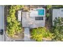 Aerial view of the property showcasing the backyard pool and surrounding greenery at 14000 104Th Ave, Largo, FL 33774