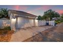 Exterior view of a detached two-car garage with white door and concrete driveway at 1436 30Th N Ave, St Petersburg, FL 33704