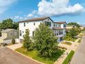 This beautiful two-story house has a brick street and a long driveway at 2110 W Azeele St, Tampa, FL 33606