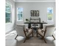 Bright home office featuring two large windows, modern decor, and wood flooring at 2110 W Azeele St, Tampa, FL 33606