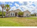Beautiful single-Gathering home with a manicured lawn, attractive landscaping, and a charming entrance at 2214 132Nd E Pl, Parrish, FL 34219