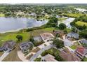 Beautiful aerial shot of lakeside homes featuring pristine landscaping and waterfront access at 2333 Camp Indianhead Rd, Land O Lakes, FL 34639