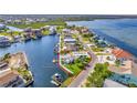 Aerial view of waterfront home in Hernando Beach with canal access at 3181 Gulf Winds Cir, Hernando Beach, FL 34607