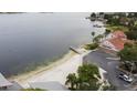 Breathtaking aerial view of sandy beach adjacent to a lake with parking and lush trees, a community amenity at 3317 Nakora Dr, Tampa, FL 33618