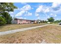 Charming one-story home showcasing lush greenery, well-maintained lawn and a welcoming curb appeal, perfect for families at 3317 Nakora Dr, Tampa, FL 33618