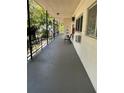 Balcony with chairs and iron railings, offering a relaxing outdoor space at 4051 58Th N St # 241C, Kenneth City, FL 33709