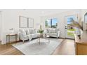 Bright living room with comfortable seating, a neutral color palette, and ample natural light at 411 37Th S St, St Petersburg, FL 33711