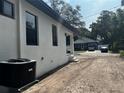 The exterior features large windows, a covered entryway, and a central AC unit at 4241 E Palifox St, Tampa, FL 33610