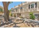 Beautiful townhome with mature trees and landscaping enhancing its curb appeal at 5435 Sweetwater Terrace Cir, Tampa, FL 33634