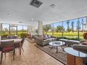 Inviting common room featuring comfortable seating, large windows, and scenic views of the property at 5700 Escondida S Blvd # 401, St Petersburg, FL 33715