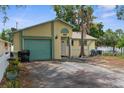 Charming home with attached garage, fresh exterior paint and well manicured lawn at 6028 Central Ave, New Port Richey, FL 34653