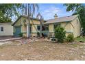 Charming single Gathering home featuring a front yard, garden, and pleasant curb appeal at 6028 Central Ave, New Port Richey, FL 34653
