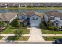 Beautifully landscaped home with a lake view in a well-planned community at 10313 Wine Press Ave, Riverview, FL 33578