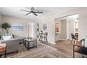Open-concept living space with stylish decor and seamless flow into the adjacent dining area at 132 Dartmouth W Ave, Oldsmar, FL 34677