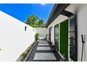 This unique home features an outdoor shower and tub in a private courtyard at 13916 Wellesford Way, Tampa, FL 33624