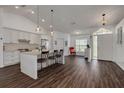 Modern kitchen with granite countertops, stainless steel appliances, and a breakfast bar at 1472 Bay View St, Tarpon Springs, FL 34689