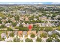 Aerial view of the community with mature trees and a pond nearby the neighborhood at 1654 Portsmouth Lake Dr, Brandon, FL 33511