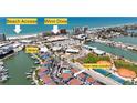 Community aerial view shows proximity to beach, Winn Dixie, library, and new condos, highlighting convenient location at 230 Medallion Blvd # G, Madeira Beach, FL 33708