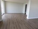 Spacious living room with new wood floors and slider doors at 2699 Seville Blvd # 802, Clearwater, FL 33764