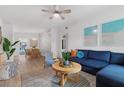 Bright living room with stylish decor, featuring a cozy seating area and cohesive design elements, perfect for relaxation at 341 Wertz Dr, Largo, FL 33771