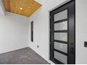Close-up of a modern front door with glass panels and brick flooring at 816 W Orient St, Tampa, FL 33603