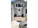 Inviting front entrance featuring patterned tiles and a welcoming front door at 8207 Volusia Pl, Tampa, FL 33637