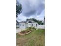 Charming single-Gathering home featuring a landscaped front yard and inviting curb appeal at 8207 Volusia Pl, Tampa, FL 33637
