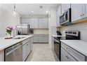 Spacious kitchen with stainless steel appliances, sleek countertops, and ample cabinet storage at 14110 Damselfly Dr, Tampa, FL 33625