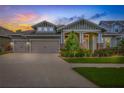 Charming single-Gathering home with a well-manicured lawn at sunset at 16712 Courtyard Loop, Land O Lakes, FL 34638