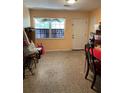 Cozy room features neutral paint, ample natural light, and a functional doorway to the exterior at 1806 Marvy Ave, Tampa, FL 33612