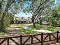 Beautifully landscaped property with a long driveway leading to the house at 2621 Stearns Rd, Valrico, FL 33596